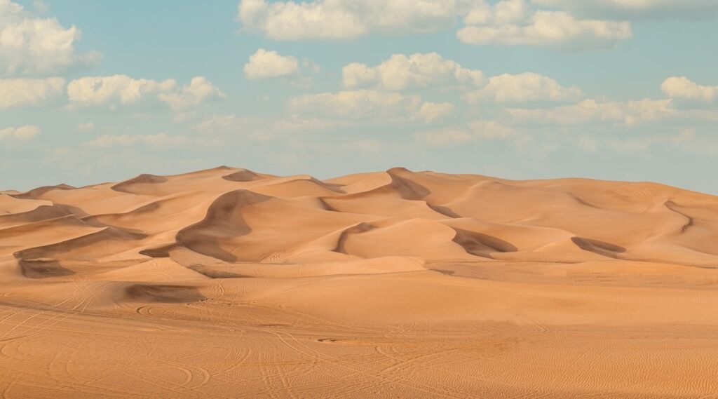 Sand dunes under blue sky, Lahbab desert, Dubai, UAE