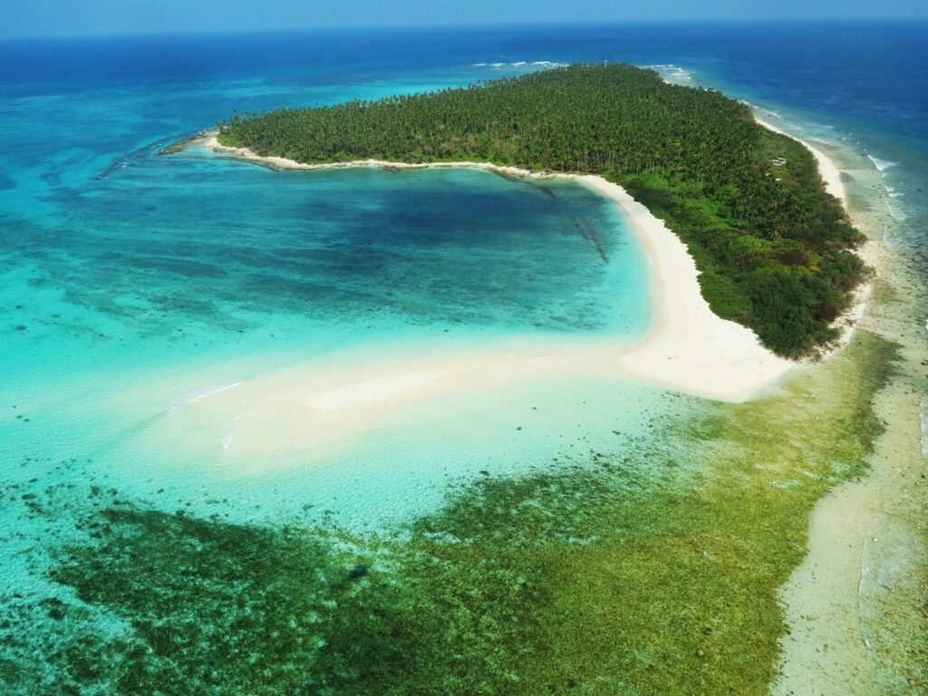 Aerial view of Lakshadweep island atoll with turquoise lagoon