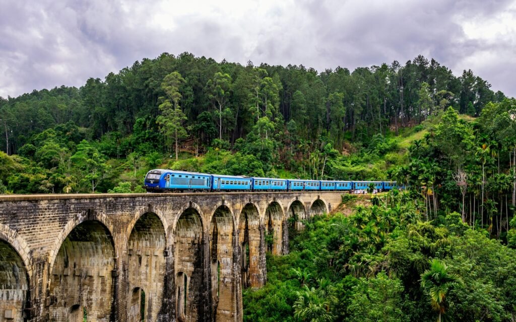 Blue train crossing Nine Arches Bridge, Ella, Sri Lanka