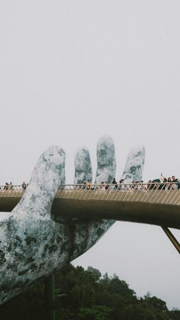 Golden Bridge held by giant stone hands, Ba Na Hills, Da Nang, Vietnam