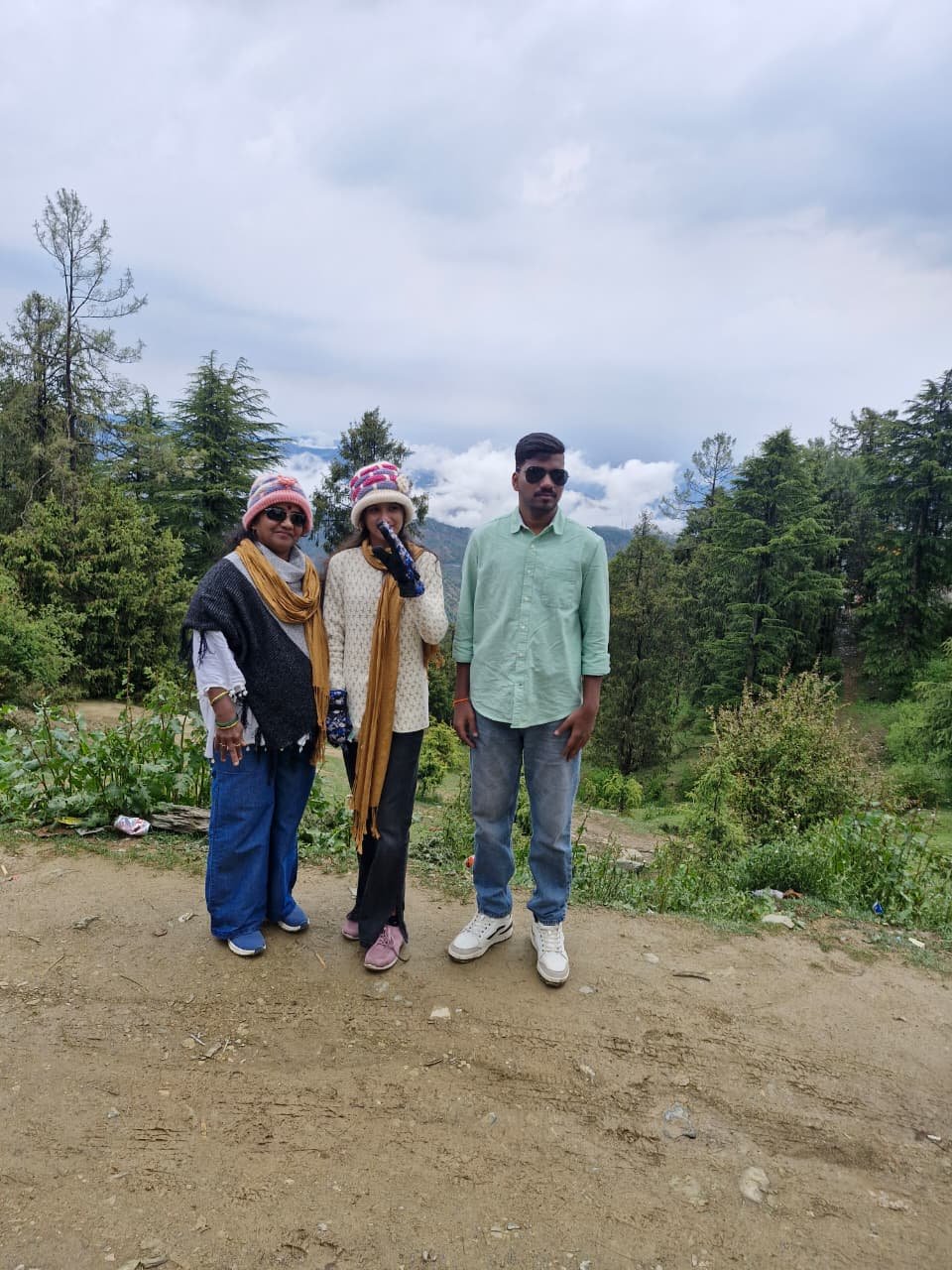 Siona Tours travellers in woollen caps at a pine-forest hill viewpoint